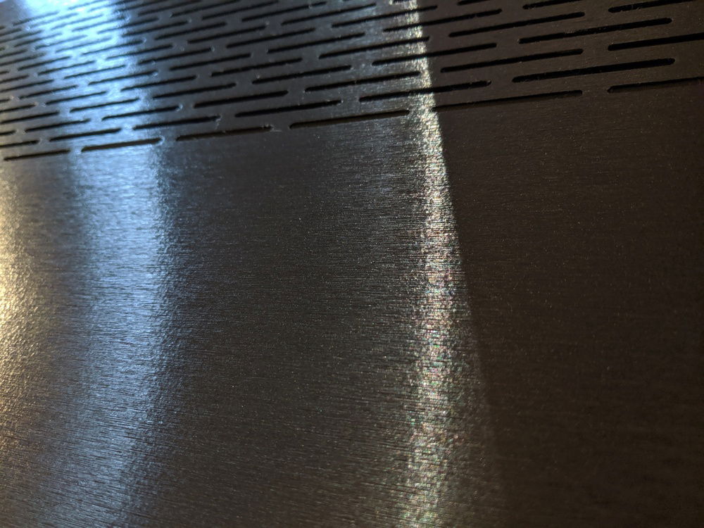 Close up shots of brushed aluminum vinyl wrap on exterior panels.