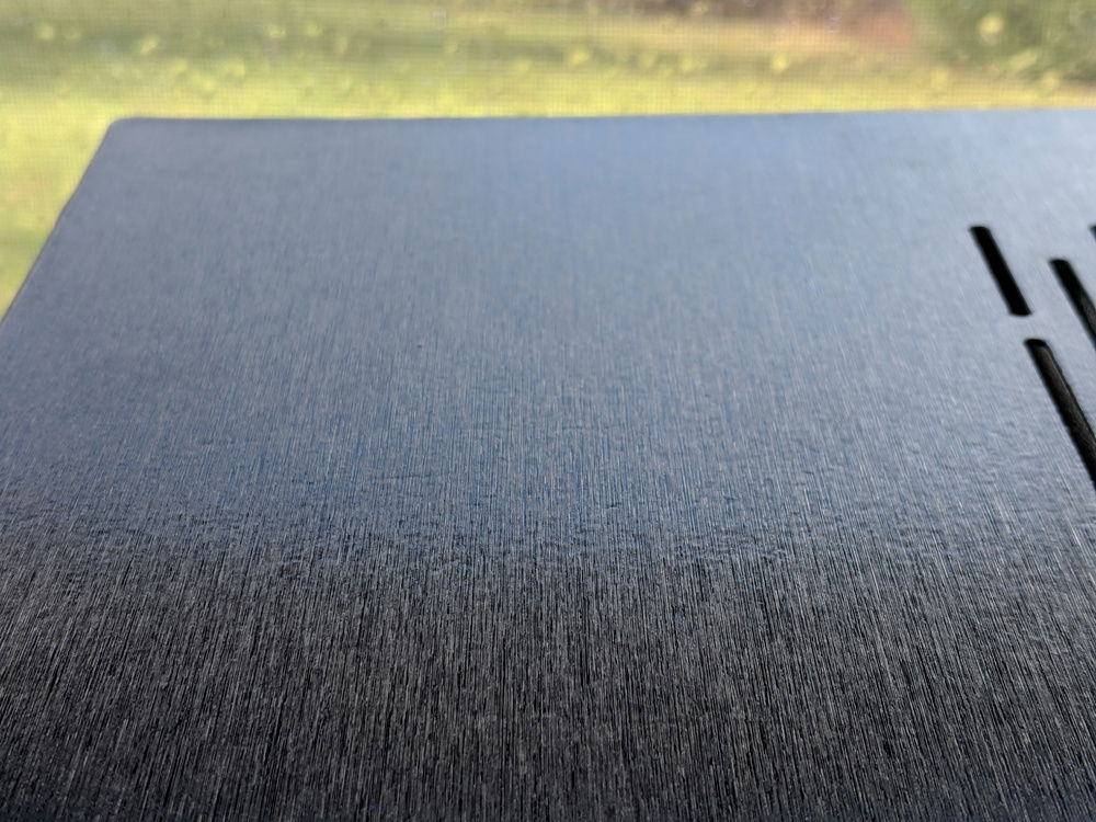 It may seem small, but one of my biggest gripes with this case is the poor quality of the paint job. There is a ton of "orange peel". I should have sanded the panels before I applied the vinyl.