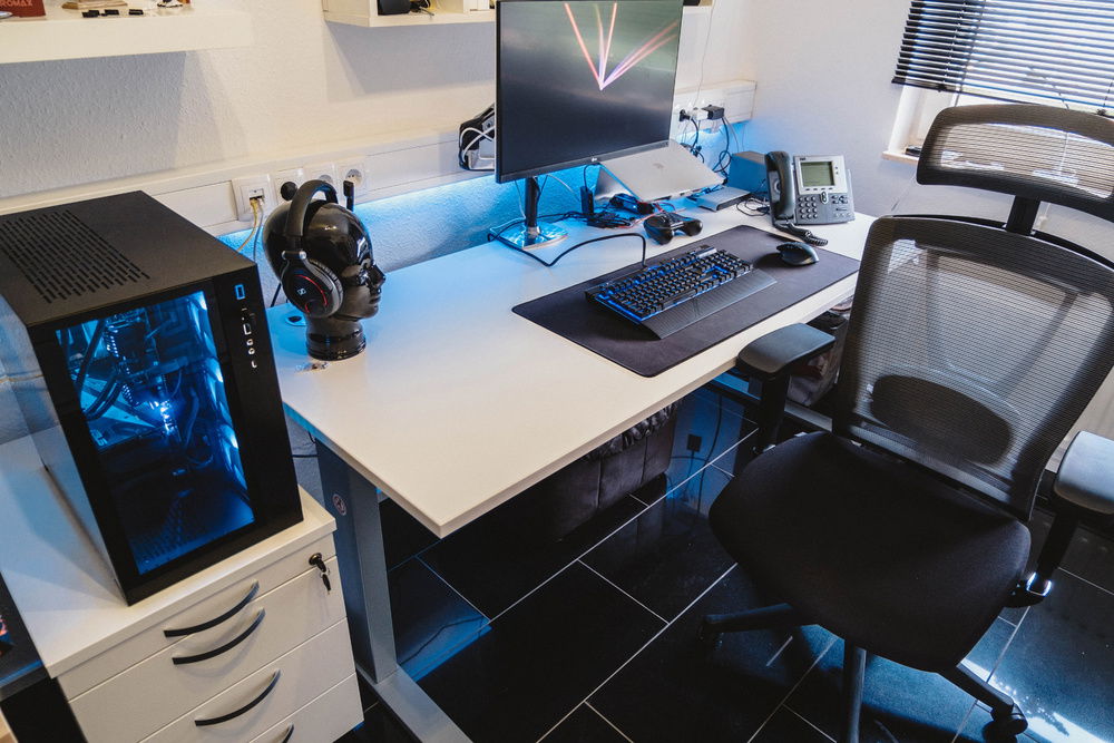 My current setup, my build on the left and the Monitor is mounted on a Ergotron LX-Arm.