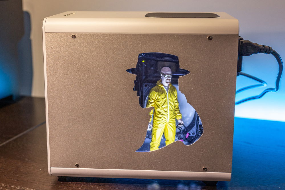 Laser cut custom side panel, made from 3mm brushed and sandblasted aluminum. Window is clear acrylic.