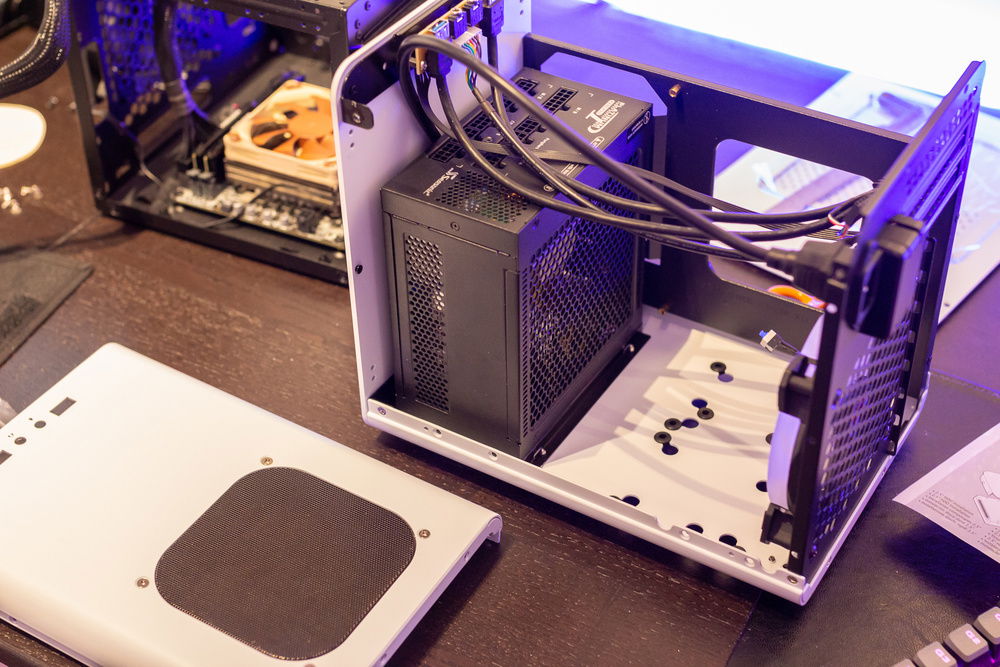 Ripping apart the small case to see if the full ATX PSU even fits inside. It's fanless, by the way.