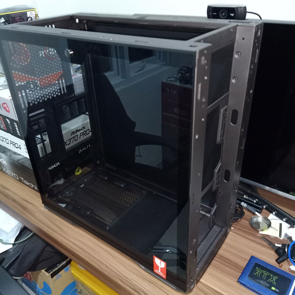 Paint the chassis with gunmetal so it'll blend with the motherboard color.