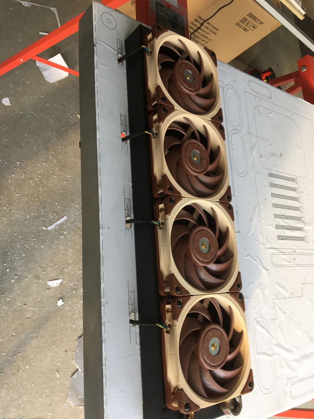 Test fit of radiator - figured out the scaling issues here.  Also, I cut cable holes for the fans.