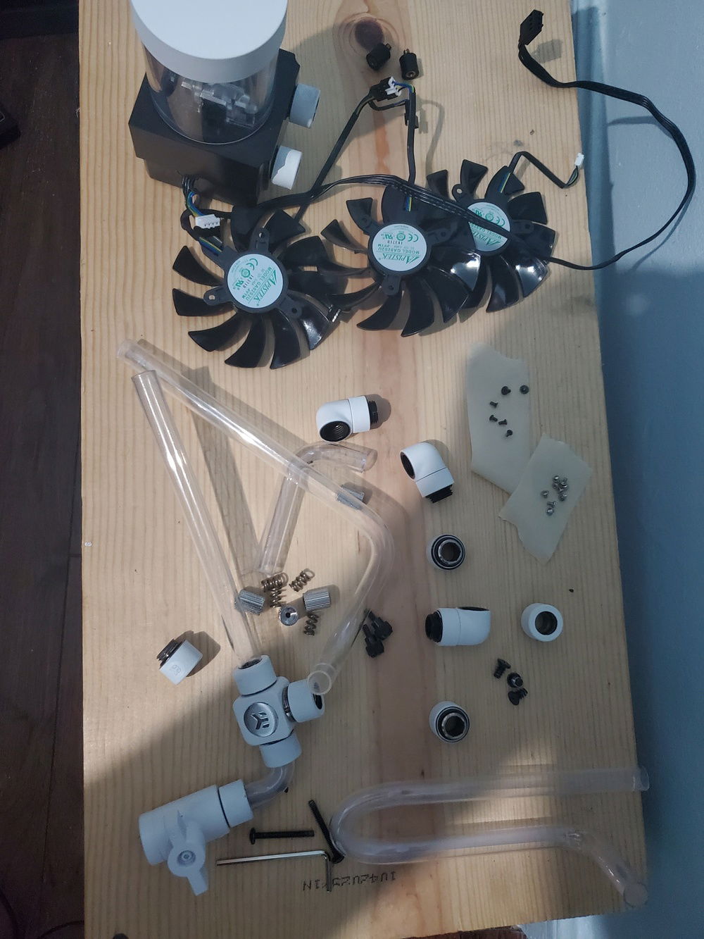 Few parts of the puzzle. GPU shroud and gpu fan bolts on tape to not lose them. :D