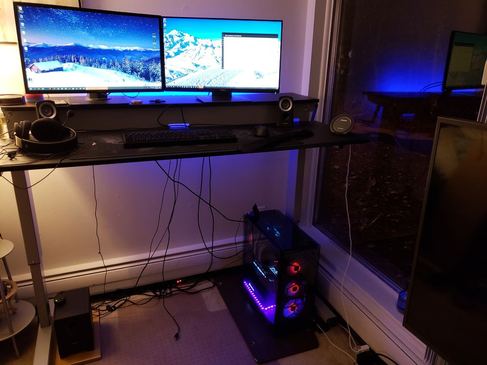 I'm a huge fan of the stand-up station. I went through quite a few desks before sticking to this one. 

The chair is a Staples Hyken Technical Mesh chair.