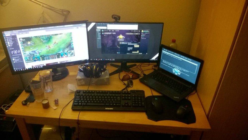 PC under table, chill/messy desk setup.