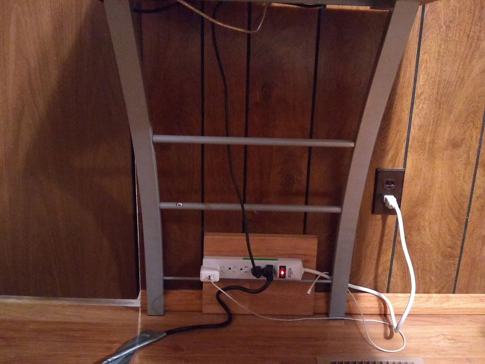 I guess I could've ran the monitor cord down the leg, but it would look worse because you can see the other side of the desk.