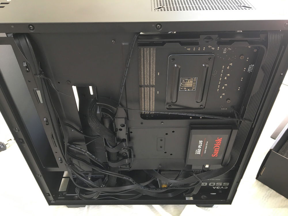 Shoving half the cables behind the PSU counts as cable management technically speaking.