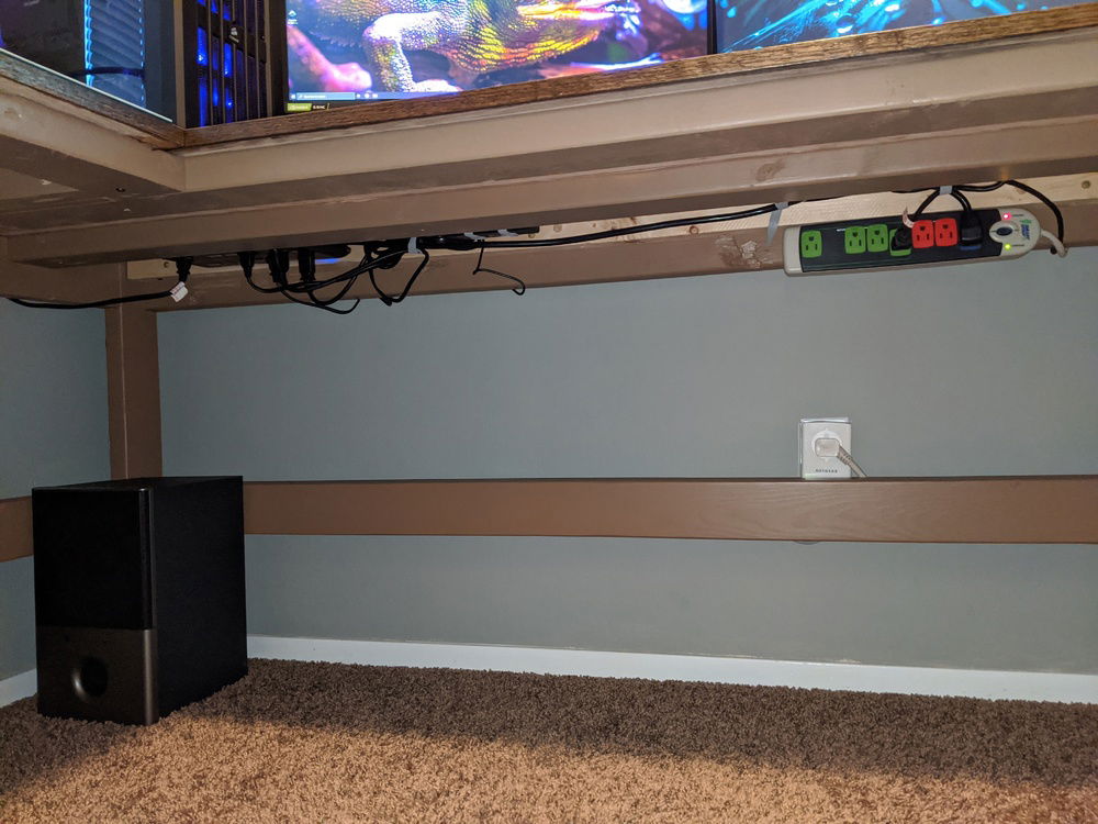 Under desk cable management. Velcro straps are stapled all over the hidden areas for routing cables.