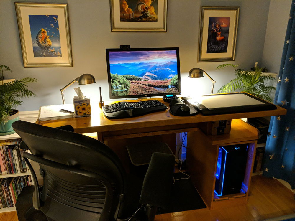 The desk it sits on. The surface is actually drawer rails, and slides to center either the keyboard or tablet, depending on what she's doing.