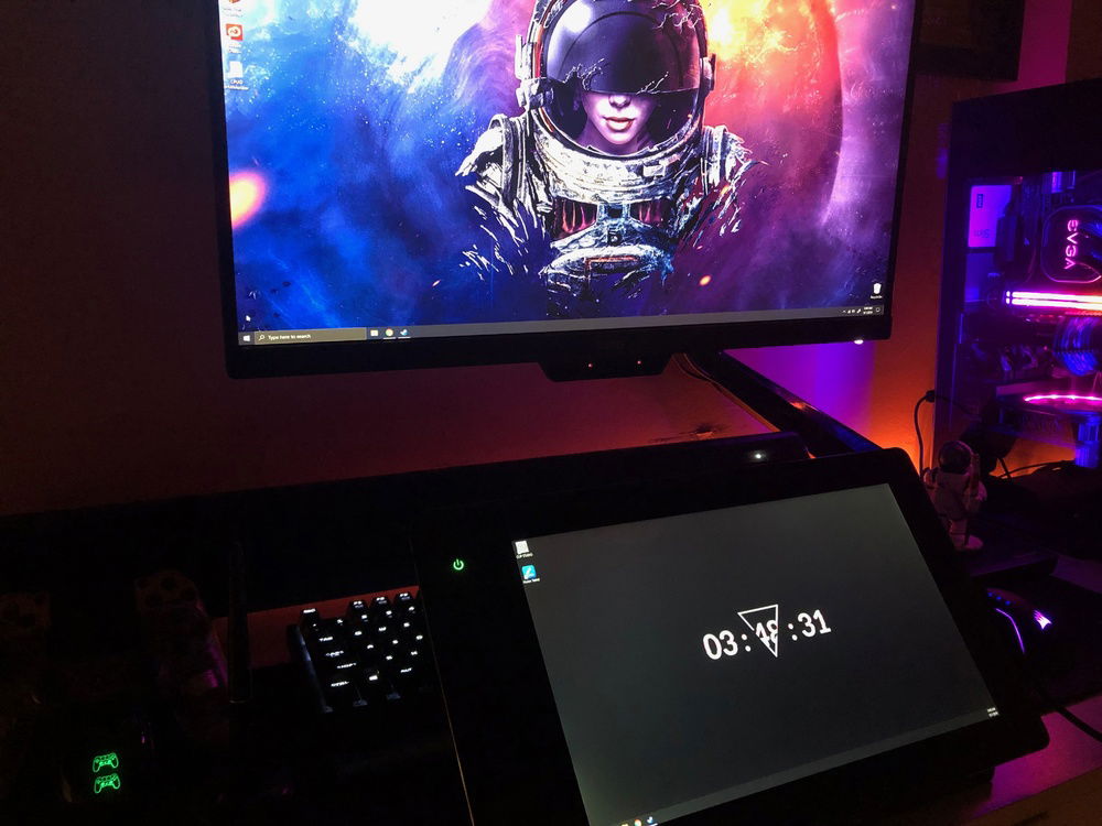 Setup for digital art production, with enough space for the drawing tablet to move over in front of the keyboard. In this arrangement I use my wireless logitech K400 keyboard+trackpad when I need to type, etc.