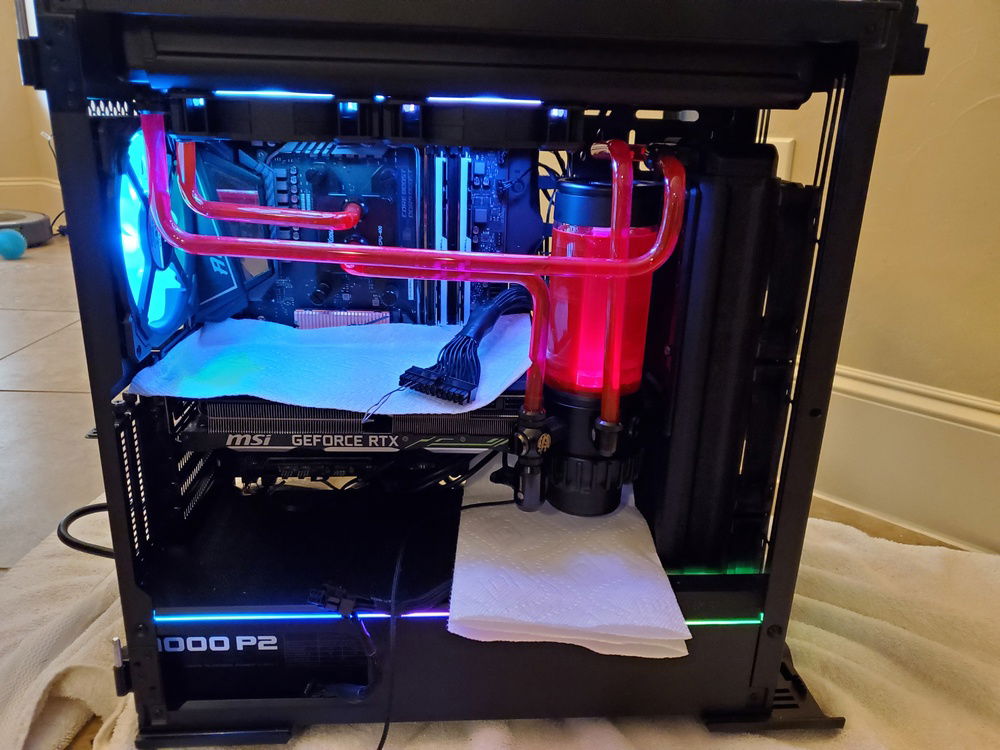 Put the coolant in to test for leaks - two minor ones easily fixed by tightening connections.  Bigger issue is that the drain port on the reservoir is blocking the power ports for video card.  Any suggestions?  The reservoir can turn on the support so I moved the drain port away but not sure how to correct my mistake quickly.