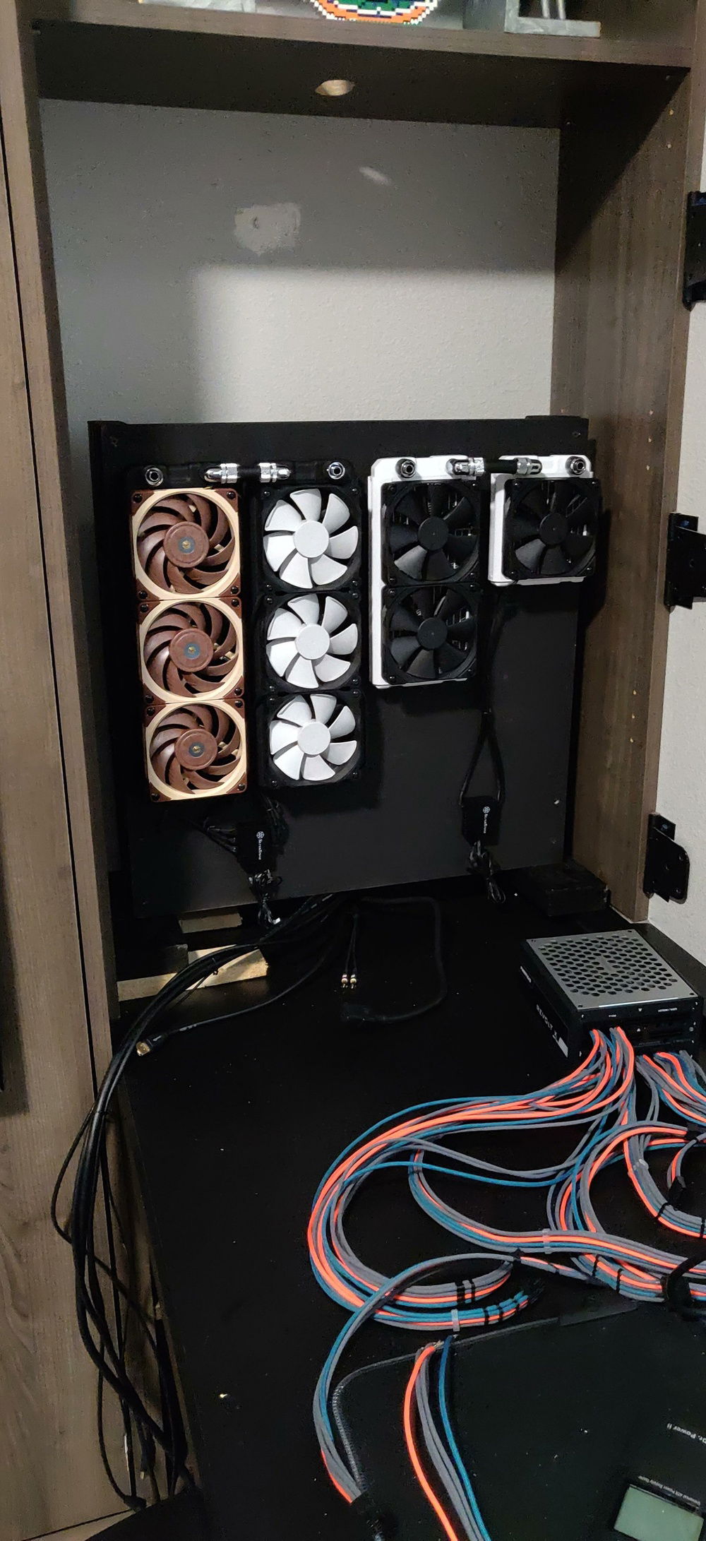 Rad setup behind the PC.  (360mm x 2 for me, 120mm + 240mm for wife).  I would have made this uniform but already had all the rads.