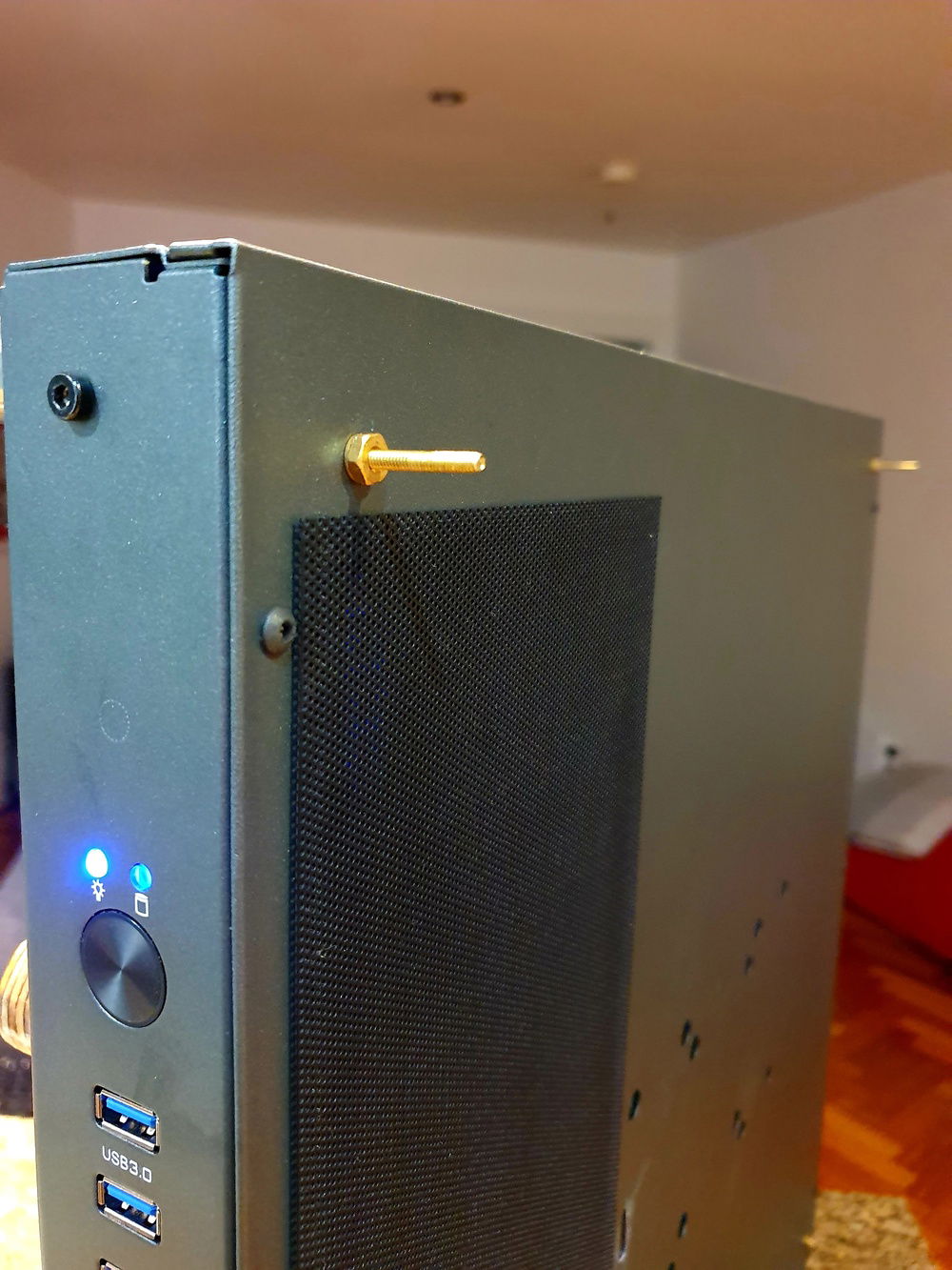 One of the 4 screws the wooden back cover slides onto.