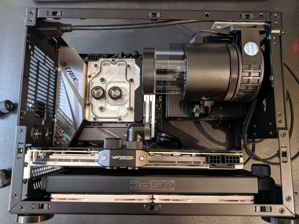 Mounted the pump & reservoir. I used some angle brackets and drilled small holes in the front of the case.