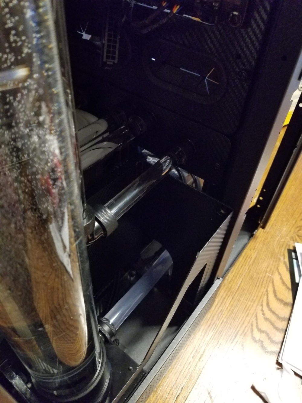 I ran soft tubing for the pump intake.  It's in the bottom of the case where you can't really see it unless you look, and it's straight/rigid enough that it looks good.