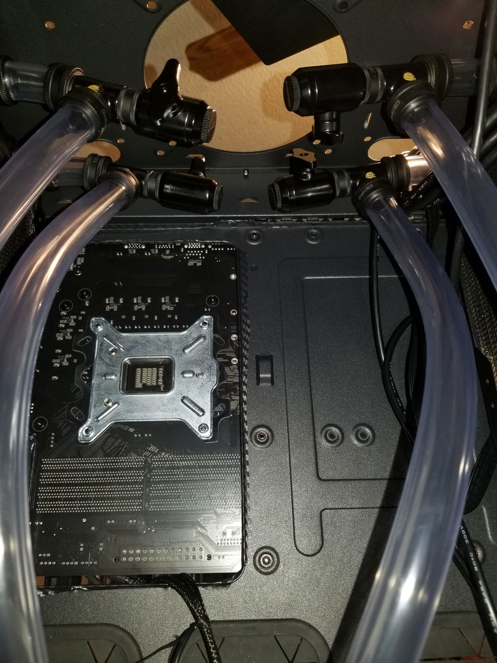 Drain valves at the top to give extra hose length for maintenance and because there is way more room there than at the bottom with the PSU installed.  Double the valves that I need, but it should allow for better drainage when it comes time for fluid changes.