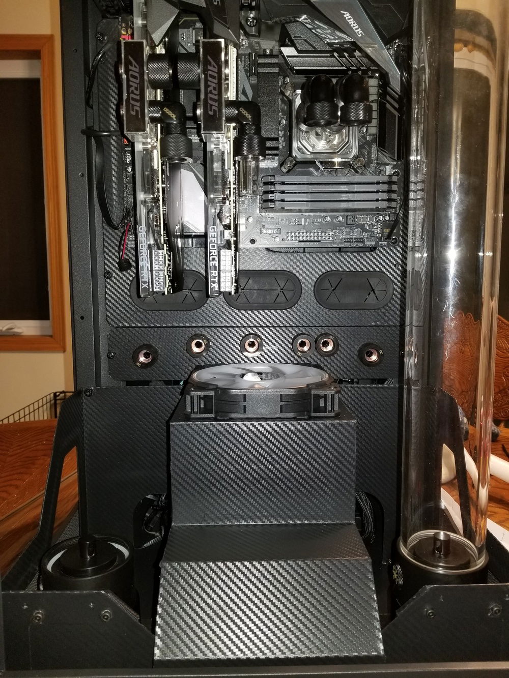 I forgot to get a picture of the printed plate by itself, but here it is, wrapped, with the bulkhead fittings installed, and installed in the case.  This plates is so much more rigid than the acrylic sheet, with just a touch of flex if needed for installation.  And the lines match up.  Couldn't be happier.  

Also, pulled the trigger on a second RTX 2080 when I saw a single, open-box 3-slot NVLink bridge on Amazon.  4-slots are available all day long, but apparently they only made about 5 total of the 3-slot.  Seems like a massive oversight considering they made their motherboard with 3-slot spacing.