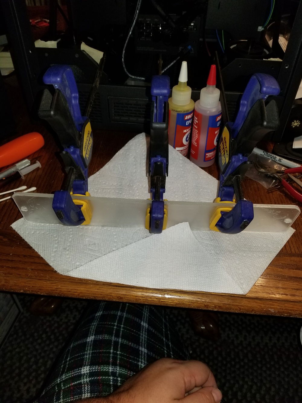 I decided to use bulkhead fittings mounted to a solid plate for a pass-through on the water lines.  This will allow me to easily and cleanly transition from hard pipe in front for aesthetics, and soft tubing in the back for maintenance and ease of installation.  I cut two pieces of plexiglass and used epoxy to weld them together.  This is my first time working with plexiglass and it's a pain in the ass.  Not sure about the rigidity on this, but we'll see how it works out.