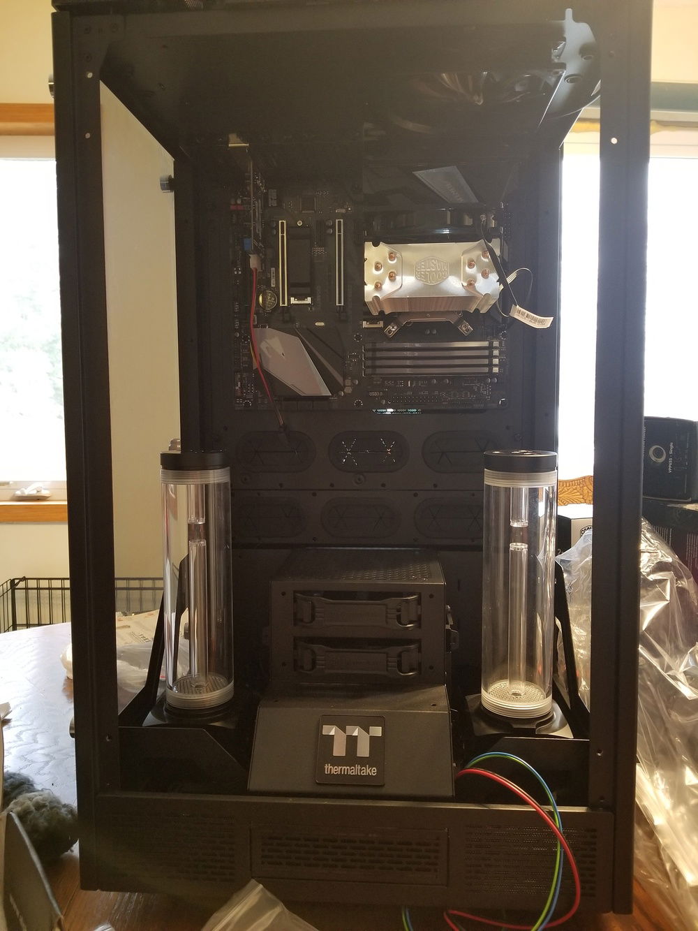 The Alphacool Eisbecher 250's look so tiny in this case.  I may have to look into other options, which sucks because the build quality on these is fantastic.  Cooler Master CPU block is temporary for testing components in the interim as I have a feeling running the water cooling components will take some time.