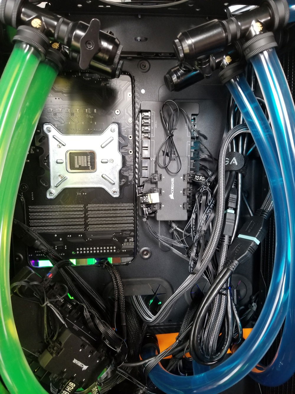 There's only so much you can do in terms of cable management when you have this many light strips, fans, pumps, and RGB.  Short of customizing the lengths of every cable, there really isn't much room for improvement.