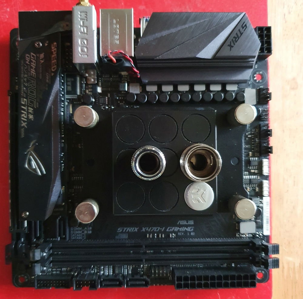Mobo with Block Fitted - One standard EK fitting and one extender fitting.