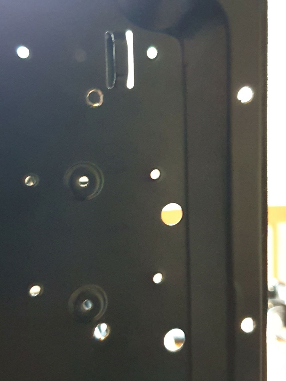 Pump Mounting Hole - 4 drilled holes to mount the pump to the upper chamber in the chassis.  The holes to the right of the photo need low profile screws and a small amount of plastic shaved out of the cover to fit.