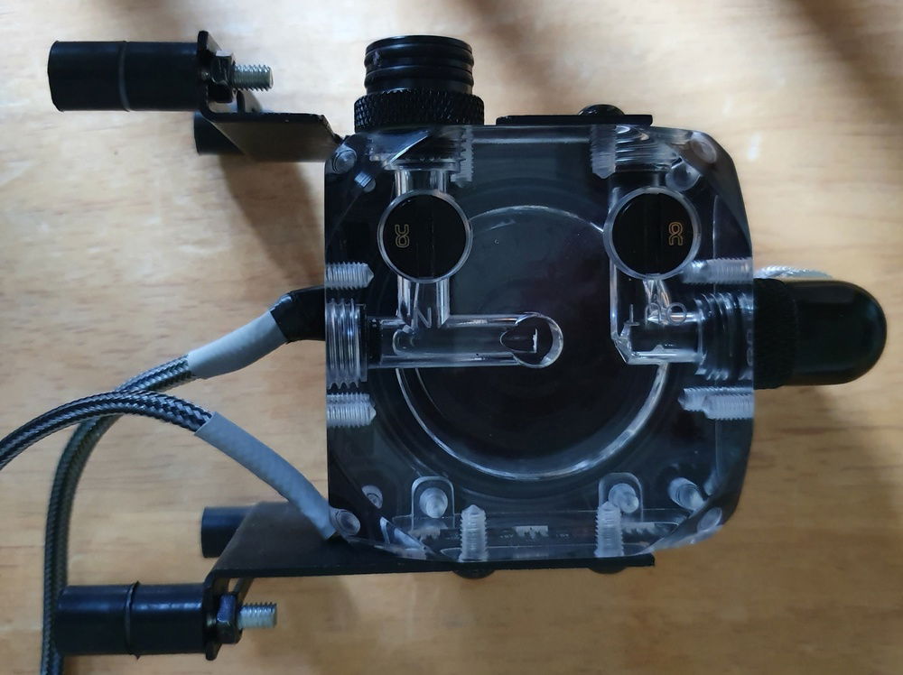 Pump and Top with modified mounting plates - I used the standard mounting plates and cut holes for the D Plug.  The rubber mounts are from the EK 3.2 Pump mounting kit.