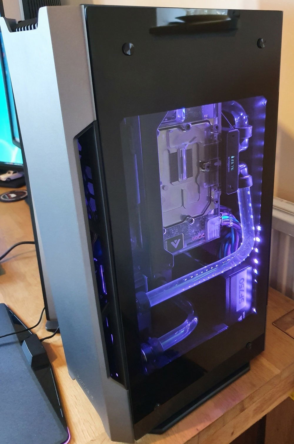 Rear - GPU has a row of LED but the photo caught the moment in-between flashes!  GPU Block guage catches idle temp (ambient 16)