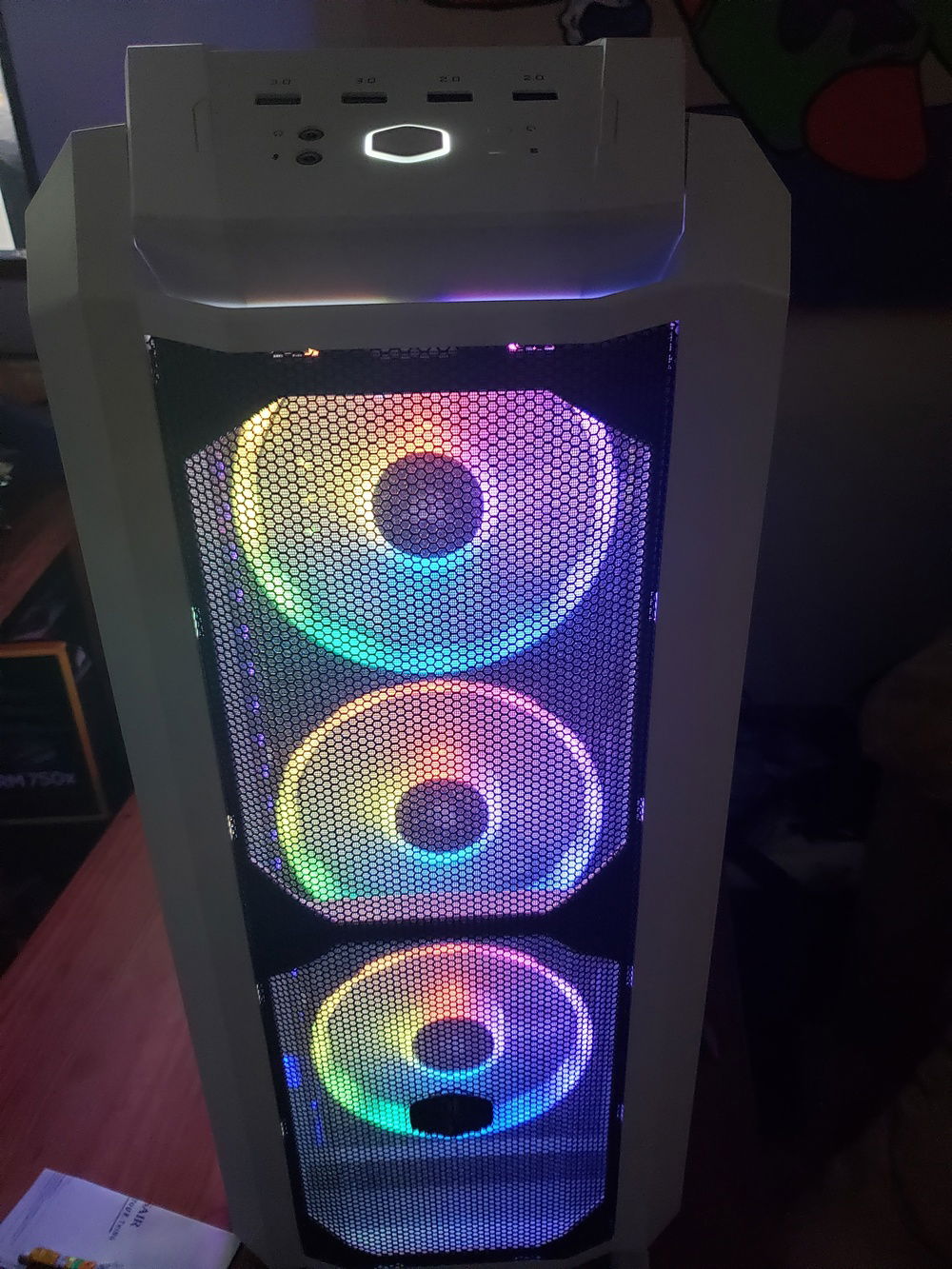 Front 3x140mm Fans in Rainbow vomit colors.