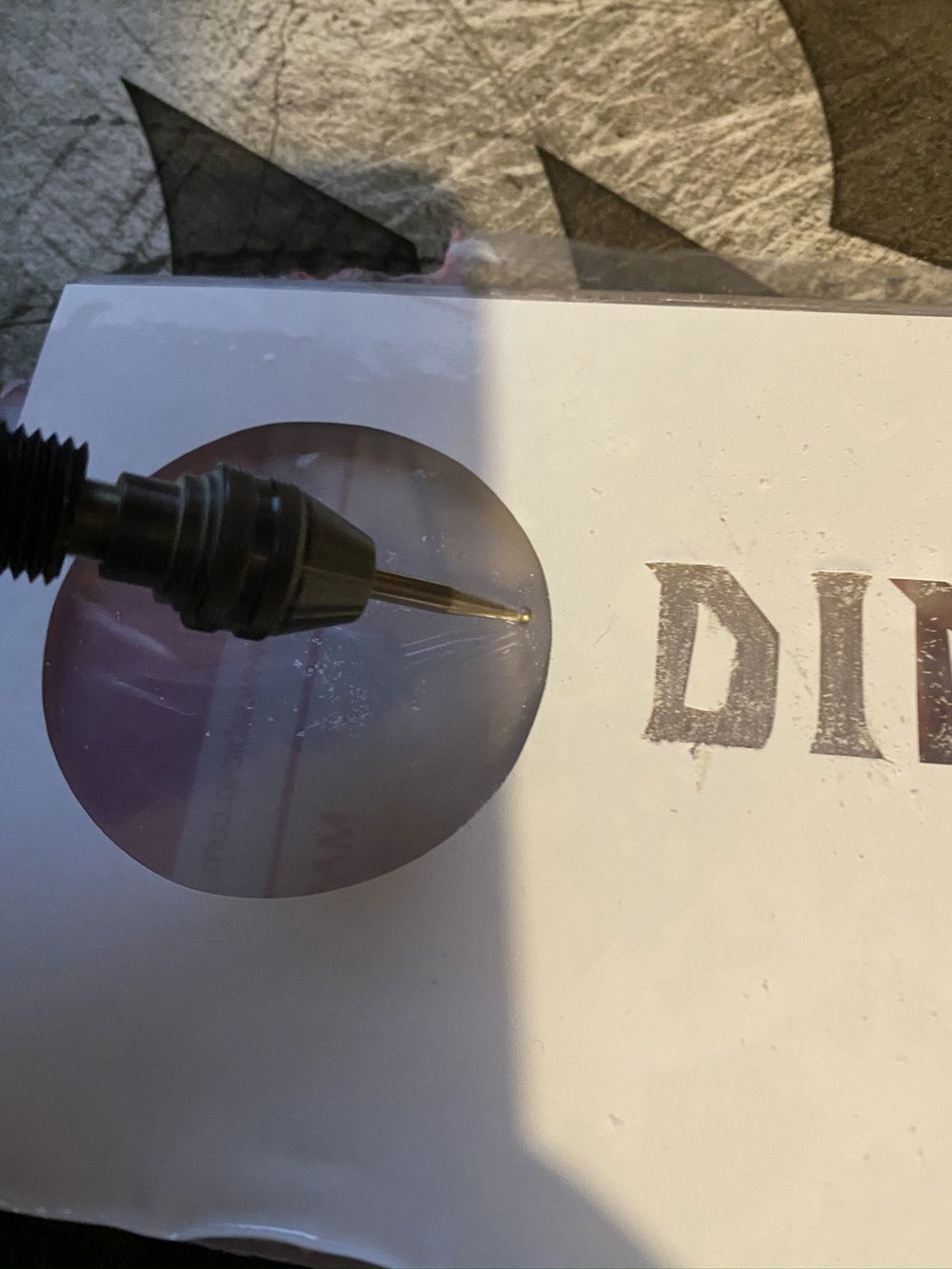 using the dremel engraving to dull up that acrylic on my stencil.