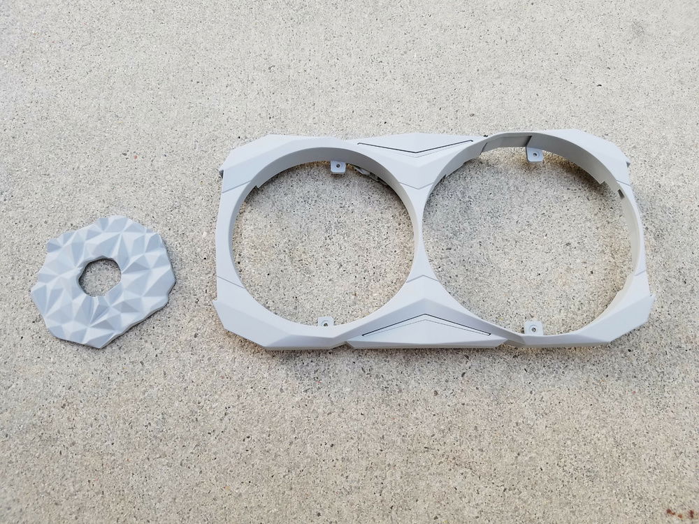 I found a plastic piece that would work well as the power button shroud. It looks like the "Titan Armor" effect from the game. Both pieces primed for paint.