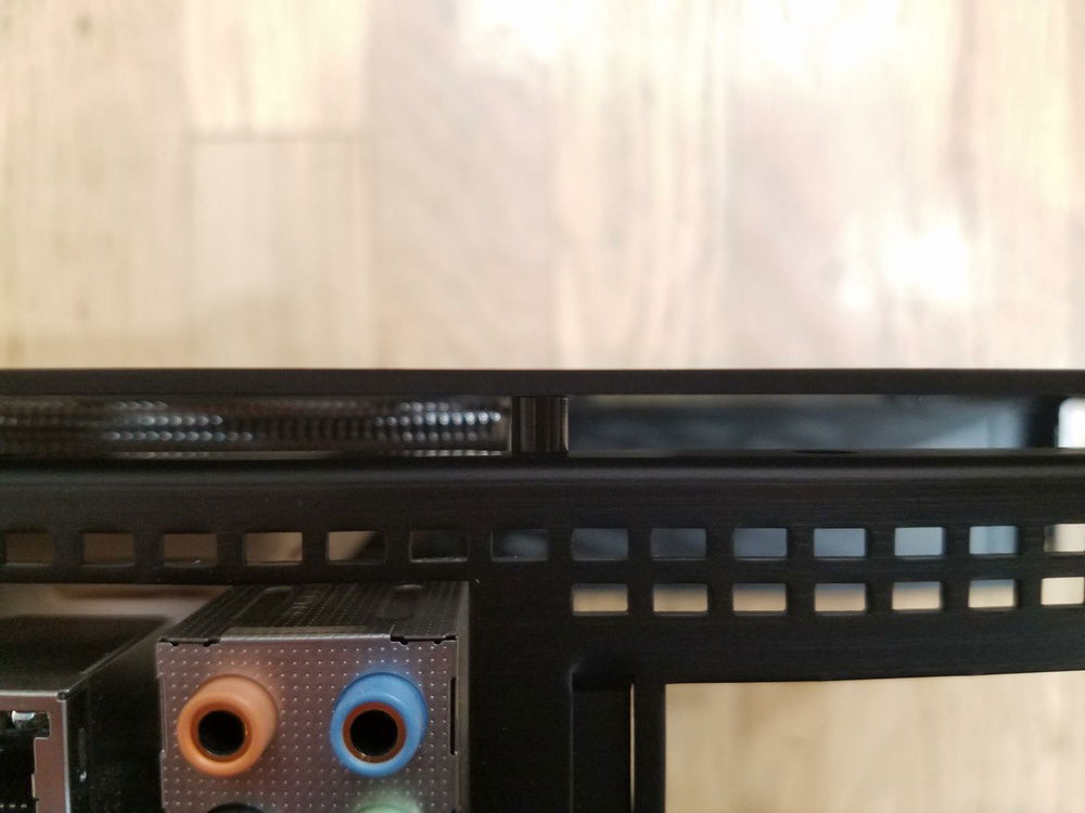 There is now roughly 1mm of clearance between the side panels and the Black Ridge cooler.