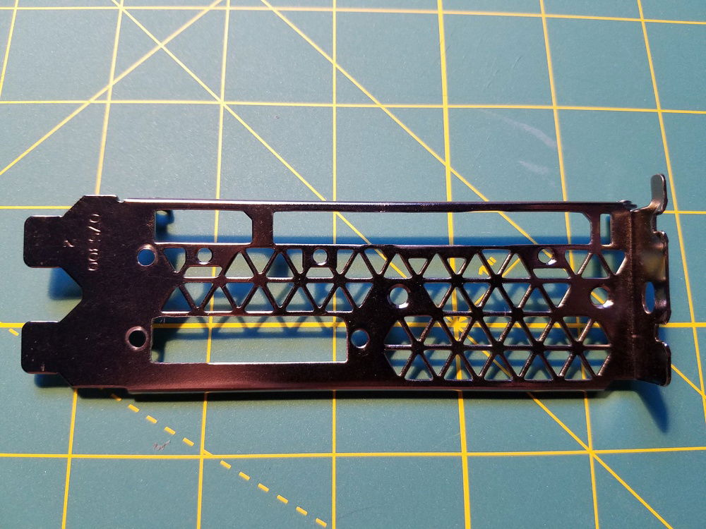 Original bracket modified with a Dremel tool.
