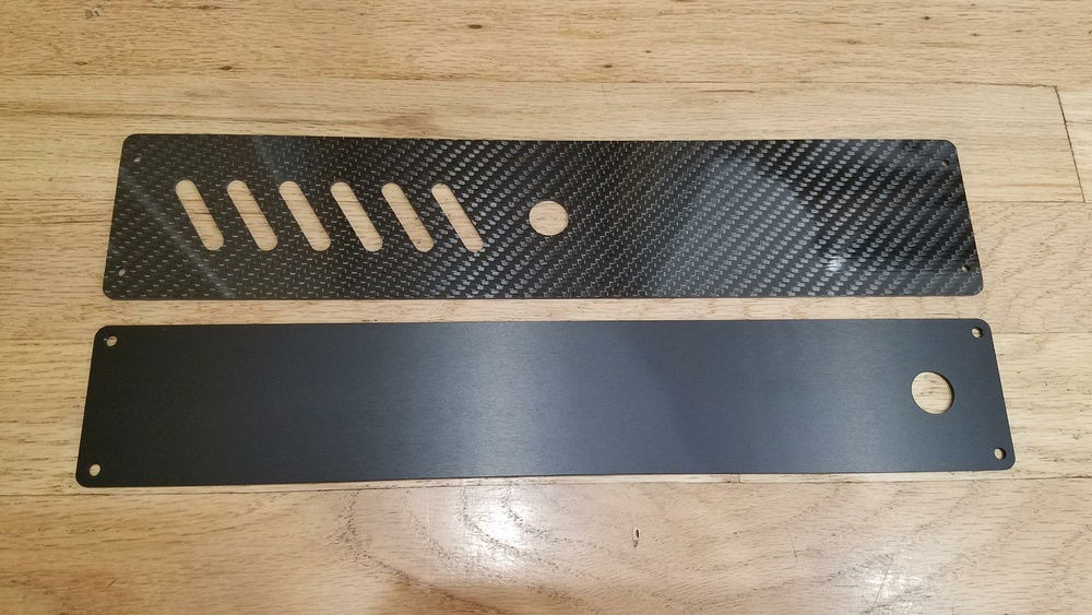 Side by side comparison of the stock and custom bezels.