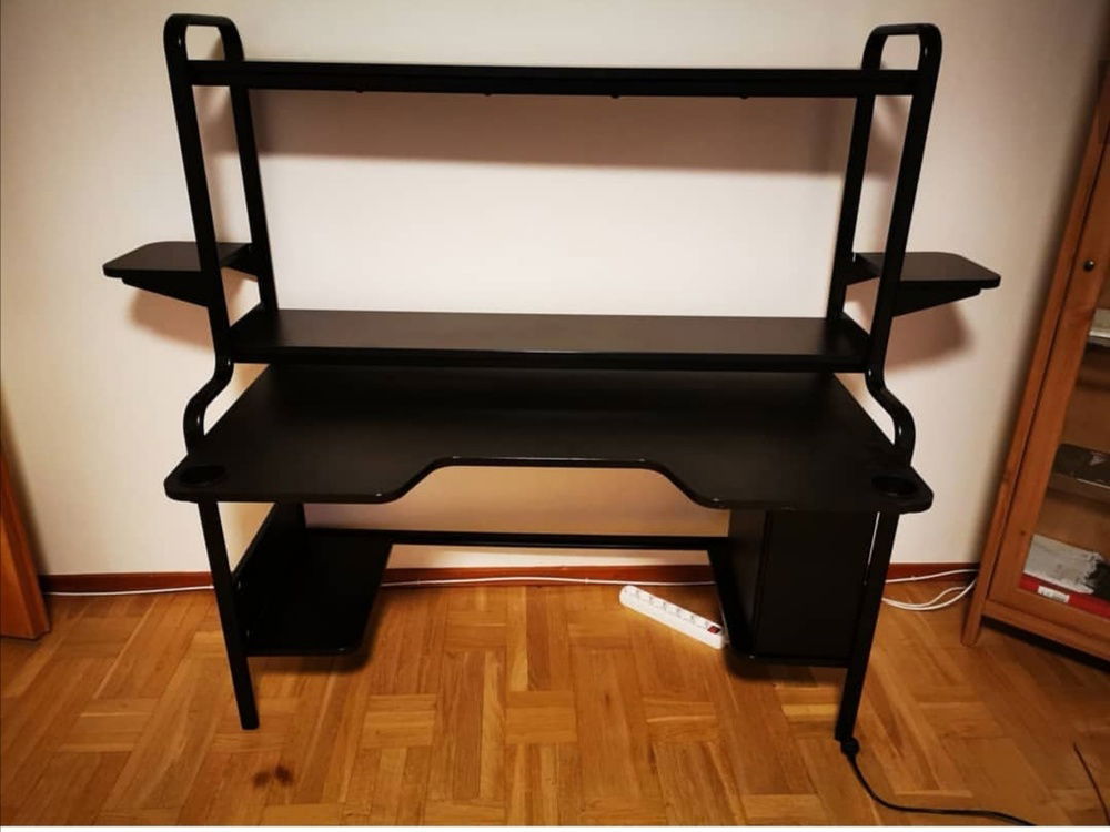 And now to the Gaming setup. The table i use is a IKEA Fredde Table due to the abillity to have the pc off the floor and also for the shelves for the speakers and subwoofer wich i eventually will get but the economy need to alow it first. this desk is also great for cable management.