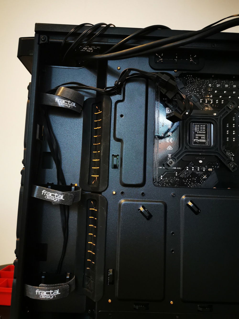 I found out that if you pull alot of the small cables behind instead of in the cable bands you are able to get them closer to the chassi and make more room for bigger cables like the 24-pin cable for the motherboard.