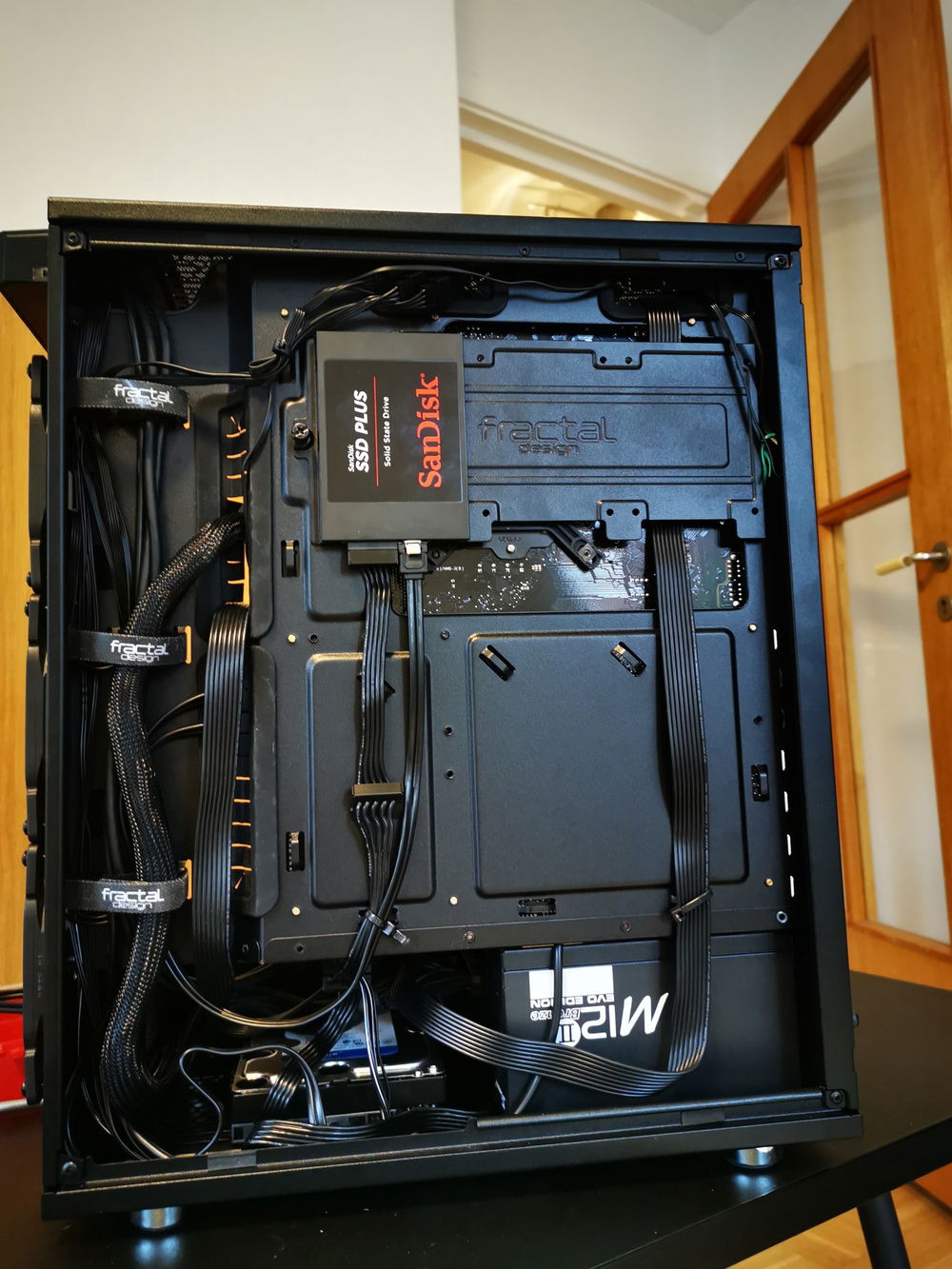 I really like how the cpu cable turned out when it got so straight instead of diagonal across the back of the case. And also when it goes behind the bracket for the SSDs.