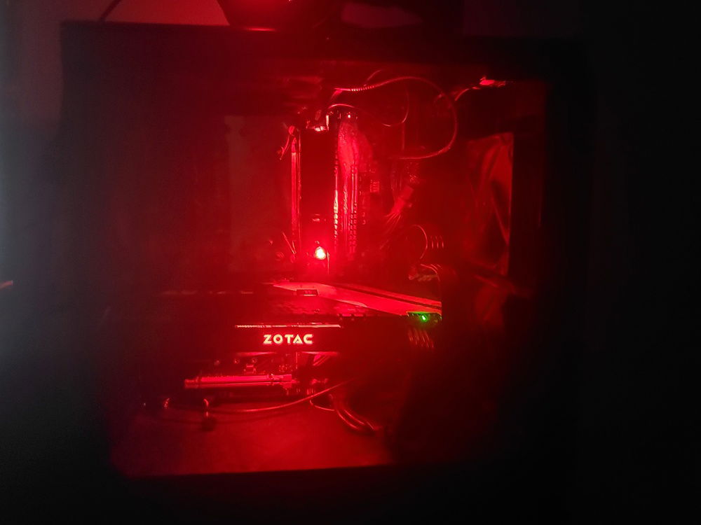 Inside the tower, not really a good picture while it's on but it looks like unholy red light is spilling from the components.