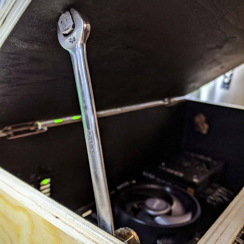 Lid prop is made out of an old 3/8" combination wrench.