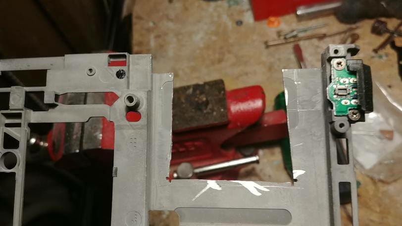 The PI is right under the Windows logo with the USB pointing towards the left. here's a part I cut from the frame :