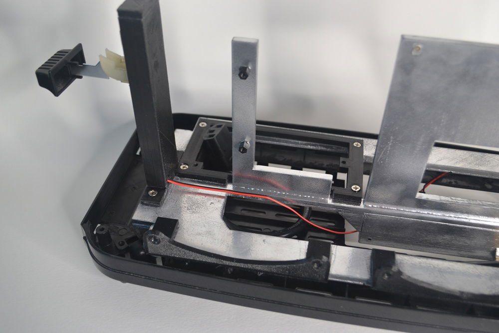 This L-bracket piece (acrylic) wasn't in my original plans, but it ended up being a better way to mount the graphics card. There are some holes on the graphics card that screw into these standoffs.