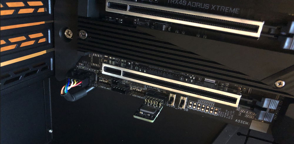 TPM module sticking out next to the BIOS switches. That media header needs some cleaning up! I might try to fix that with some heat shrink!