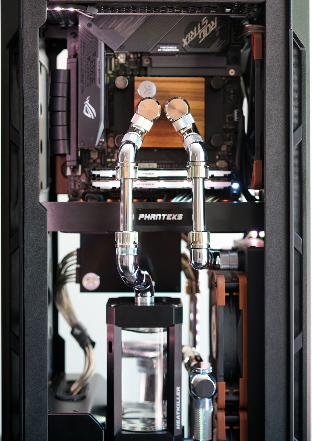 I rotated the CPU Block 180 degrees to center the ports with the case and have the outflow drop into the reservoir below. One complaint with the Lignum block is that the fit and finish below the wood isn't that great. I had some bad threads on the AM4 standoffs and had to use quite a bit of force (pliers) to secure it to the motherboard. Underneath the wood it's standard EK workmanship and I have doubts about the price premium over regular EK blocks. Looks great though.