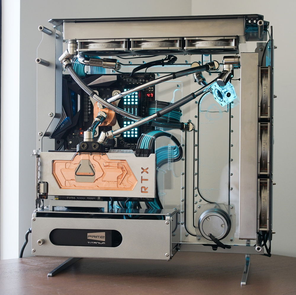 The profile shot so that you can see the @singularitycomputers reservoir built into the manifold. This drops into the D5 pump at the base of the reservoir. And this was the source of my second major leak. The instruction manual gives good advice on not tightening everything too much, as you can damage components by over tightening. As part of my final check of all the fittings in the loop I completely missed the D5 pump housing which applies pressure to an o-ring on the manifold. It was a quick fix but not before I had spilled coolant all over the new table. You can't see from this angle but the SSDs are are two Gigabyte @aorus_official M.2 NVMe PCIe Gen4.⁠