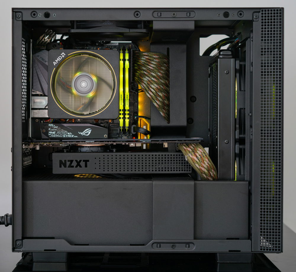 Asus B450 motherboard with a Ryzen 5 3600. I took the Wraith Prism from a high end build that's going full custom cooling. The PSU is a Silverstone SFX 650 Gold. This is just in case he gets real about SFF one day and wants to take some of these parts over.