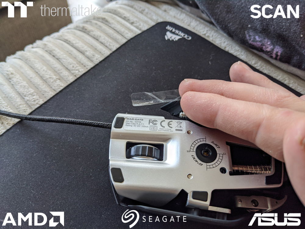 While editing my mouse kept catching on something and I saw this poking off the bottom. 6-7 years of owning my R.A.T. 7 and this sticker has only just come off.