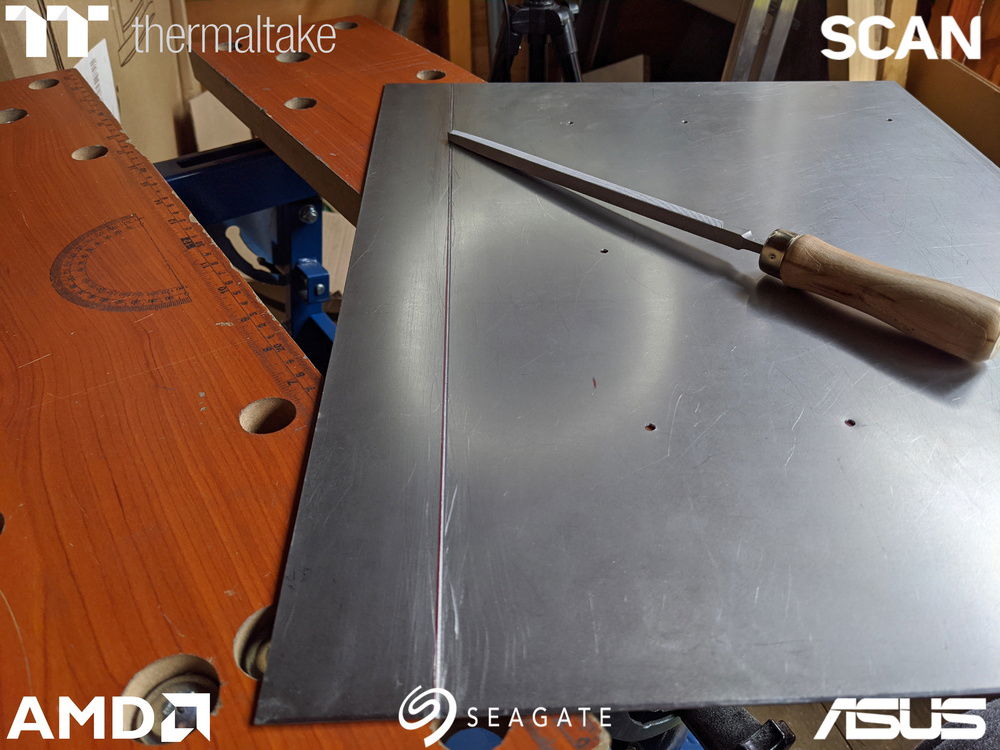 Motherboard tray grooved and ready for bending.