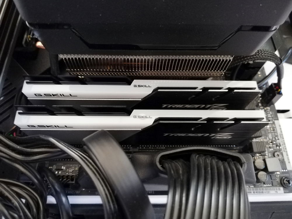 Installing the RAM modules without removing the CPU cooler or any of the cables was very fiddly work. Why did I not remove the cables? Well, they're a pain to unplug and replug and leave me with fairly sore fingertips :P