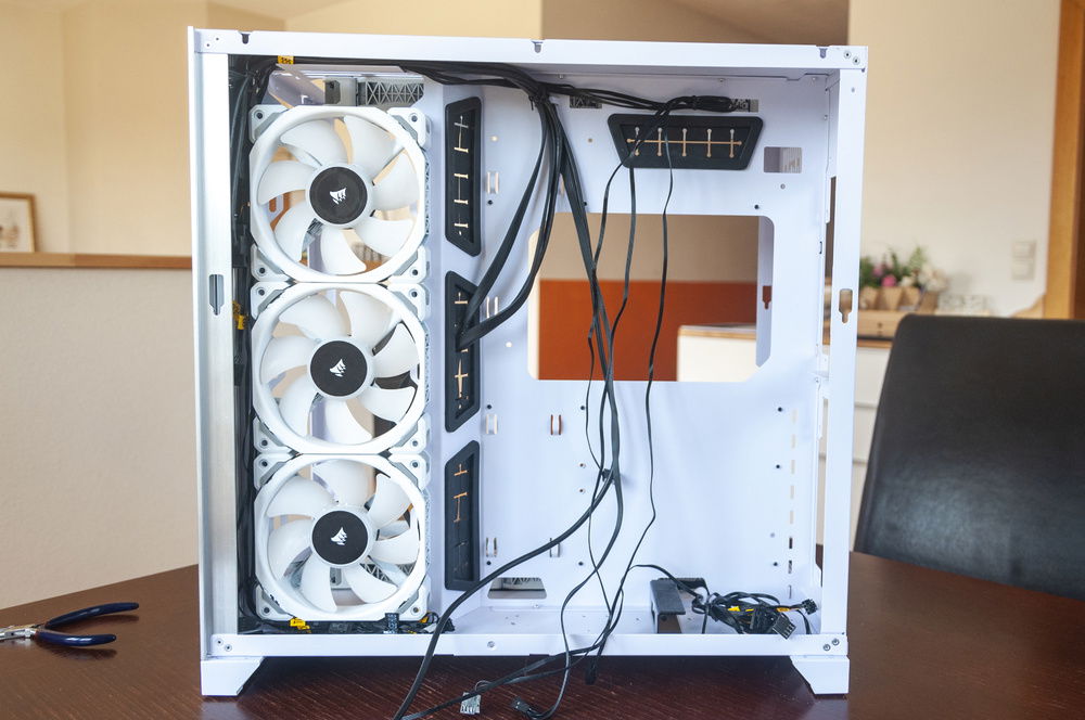 I rotated the side fans so that all of their cables could be routed along the channel at the front of the case. None of those fans will be plugged in till the splitters arrive, so those cables can be stuffed away too.
